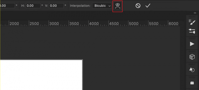 Druk op de Ctrl + T-toetsen op uw toetsenbord en klik op het Warp-pictogram in de bovenste werkbalk